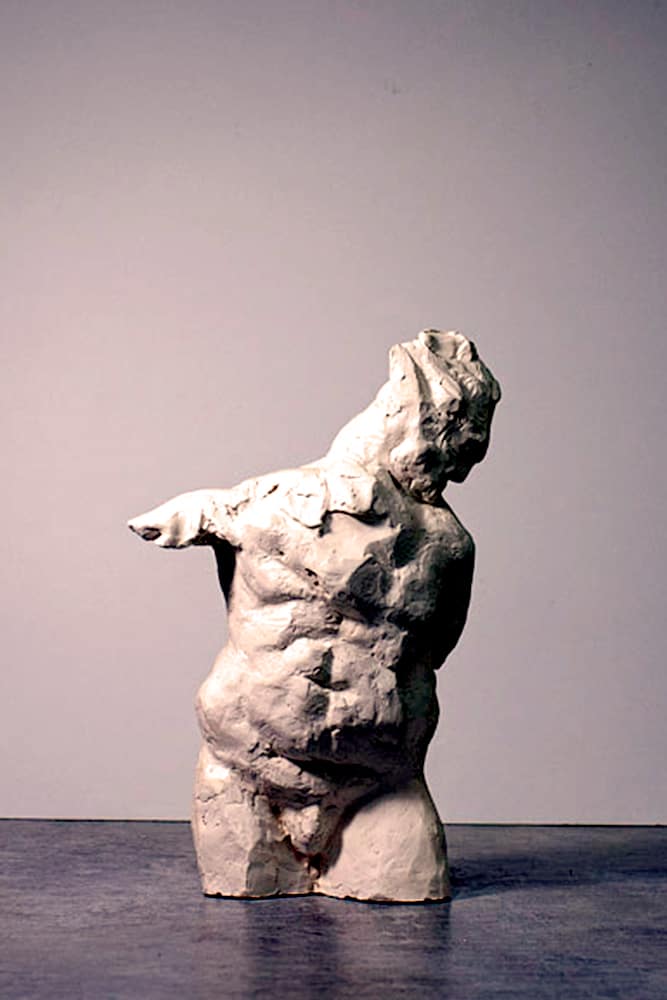 Ceramic figurative sculpture of muscular male torso with bended head by ellen scobie