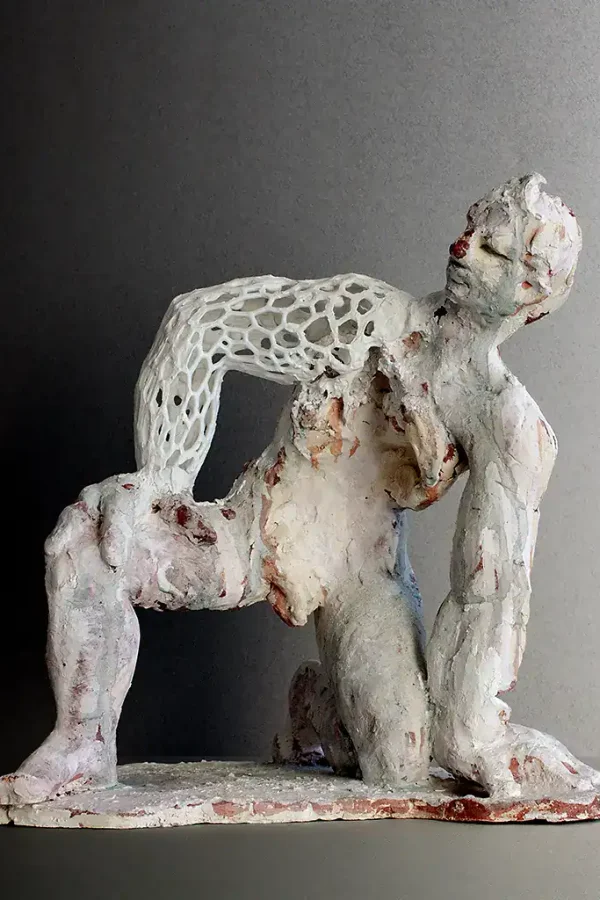 Modern mixed media art piece featuring a textured, layered human sculpture.
