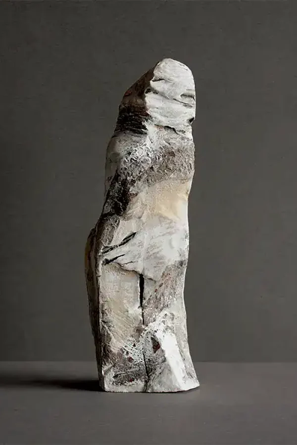 Handcrafted ceramic sculpture of an abstract figure. Unique art piece showcasing modern ceramic artist.